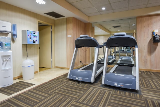 2860 S Ocean Blvd Unit 202, Palm Beach, FL 33480 - exercise room with baseboards, wood walls, a paneled ceiling, and recessed lighting