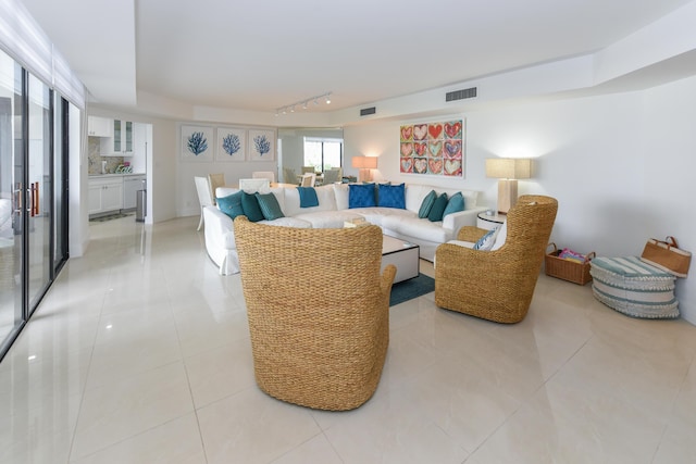 2860 S Ocean Blvd Unit 202, Palm Beach, FL 33480 - living room featuring light tile patterned floors and track lighting