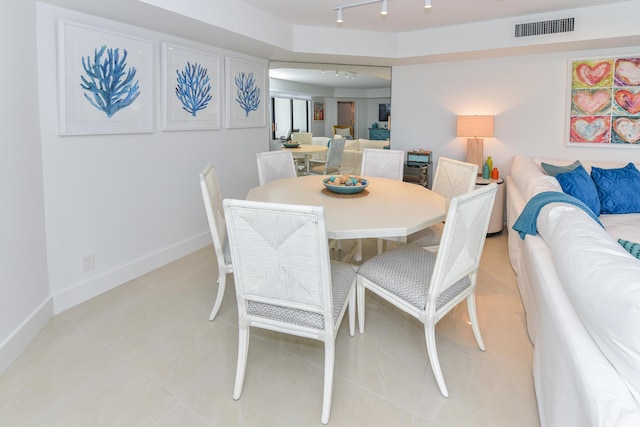 2860 S Ocean Blvd Unit 202, Palm Beach, FL 33480 - dining area featuring rail lighting, light tile patterned floors, and baseboards