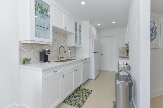 2860 S Ocean Blvd Unit 202, Palm Beach, FL 33480 - kitchen with a sink, white appliances, backsplash, white cabinets, and recessed lighting