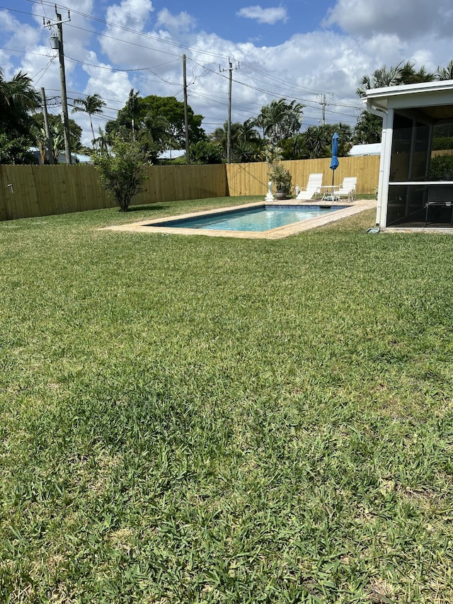 view of yard featuring a sunroom