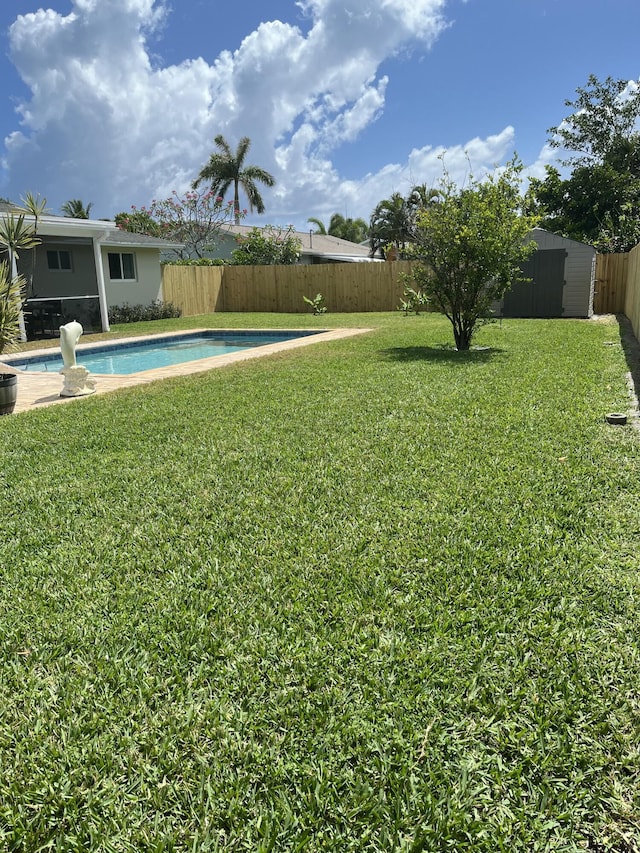 view of yard featuring a storage unit and an outdoor structure