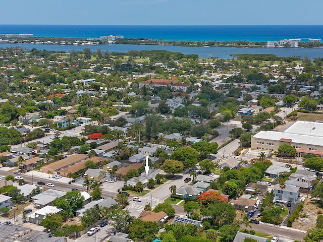 aerial view of residential area featuring a nearby body of water