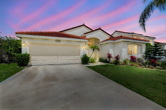 18834 Caspian Cir, Boca Raton, FL 33496 - mediterranean / spanish-style house featuring concrete driveway, stucco siding, a garage, and a yard