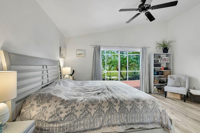 18834 Caspian Cir, Boca Raton, FL 33496 - bedroom featuring wood finished floors, lofted ceiling, a ceiling fan, and access to exterior