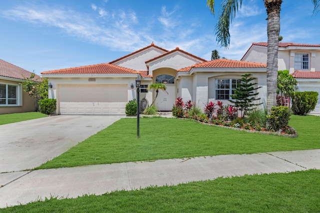 18834 Caspian Cir, Boca Raton, FL 33496 - mediterranean / spanish-style home with an attached garage, driveway, stucco siding, and a front lawn