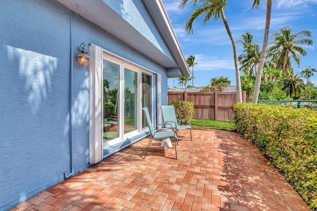 view of patio with fence