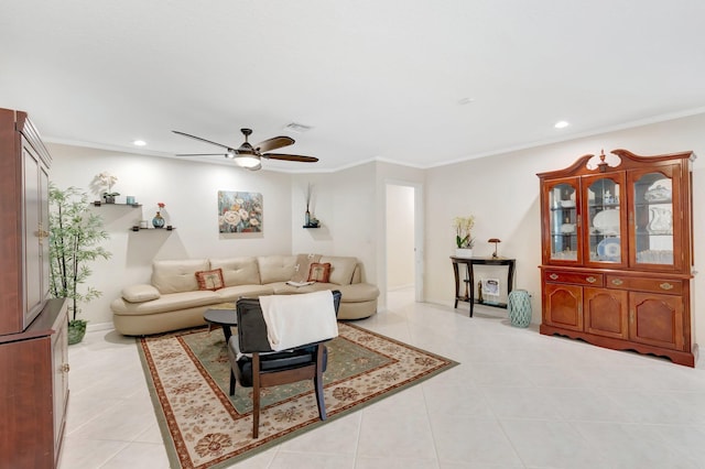 living area with a ceiling fan, light tile patterned floors, recessed lighting, ornamental molding, and baseboards