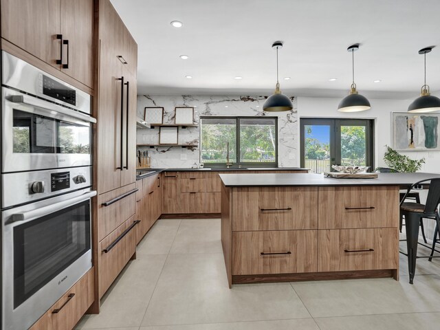 2708 NW 26th Cir, Boca Raton, FL 33431 - kitchen featuring modern cabinets, stainless steel double oven, a center island, open shelves, and backsplash