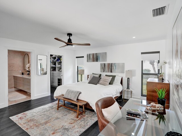 2708 NW 26th Cir, Boca Raton, FL 33431 - bedroom with baseboards, dark wood-style floors, recessed lighting, a ceiling fan, and connected bathroom