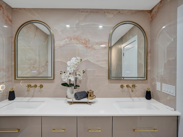 2708 NW 26th Cir, Boca Raton, FL 33431 - bathroom featuring double vanity, tile walls, and tasteful backsplash