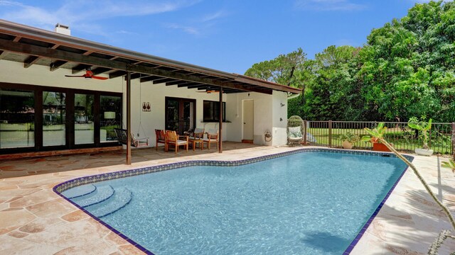 2708 NW 26th Cir, Boca Raton, FL 33431 - view of pool with fence, a patio, and a ceiling fan