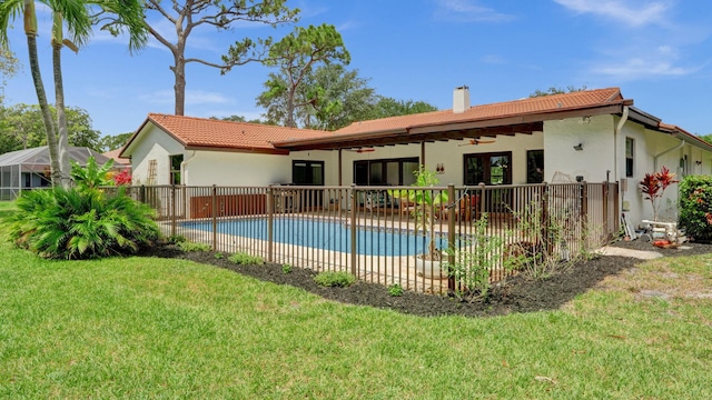 2708 NW 26th Cir, Boca Raton, FL 33431 - rear view of house featuring a ceiling fan, a chimney, stucco siding, a tile roof, and a patio