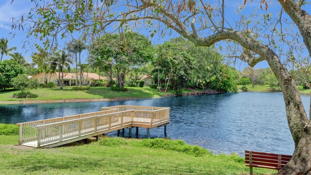 2708 NW 26th Cir, Boca Raton, FL 33431 - dock area featuring a water view and a lawn