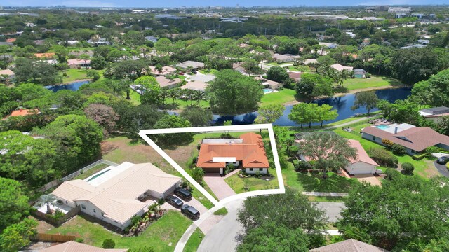 2708 NW 26th Cir, Boca Raton, FL 33431 - aerial perspective of suburban area featuring a nearby body of water and property boundaries highlighted