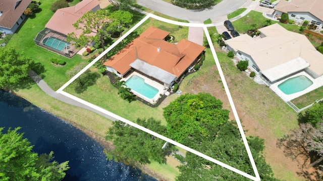 2708 NW 26th Cir, Boca Raton, FL 33431 - aerial perspective of suburban area featuring a pool, property boundaries highlighted, and a large body of water
