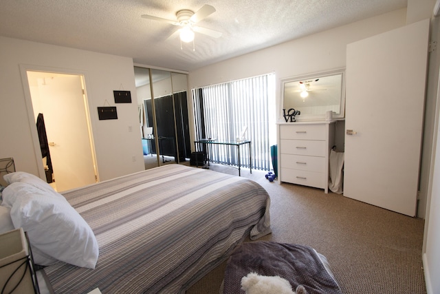 carpeted bedroom featuring a textured ceiling, a closet, and a ceiling fan