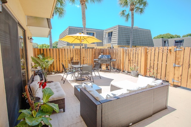 606 6th Way, West Palm Beach, FL 33407 - view of patio featuring area for grilling, an outdoor hangout area, and outdoor dining space