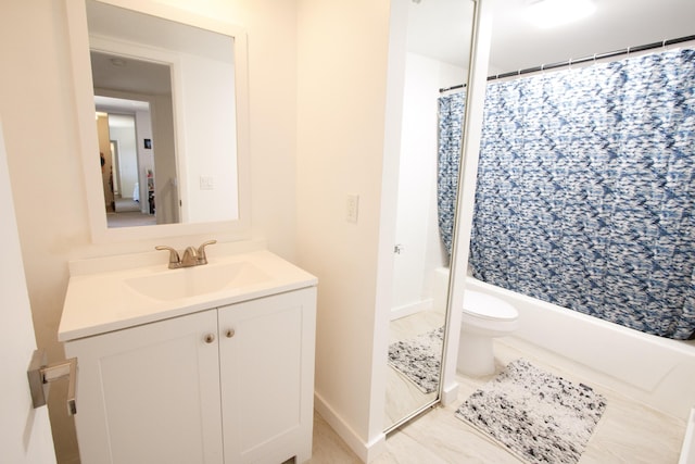 bathroom with vanity, toilet, and shower / bath combo