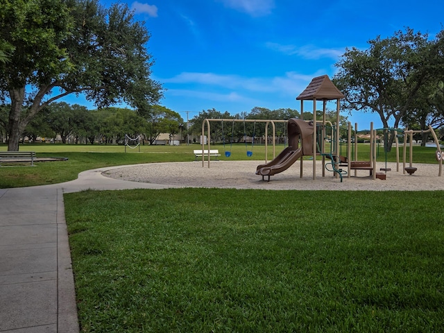 community play area featuring a yard