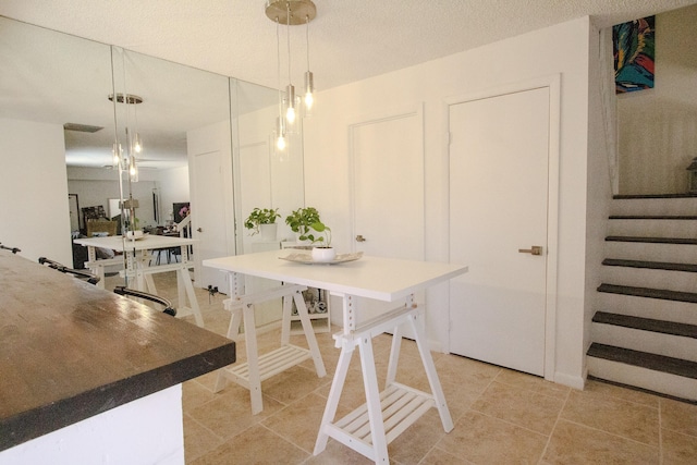 606 6th Way, West Palm Beach, FL 33407 - dining area featuring light tile patterned floors and stairs