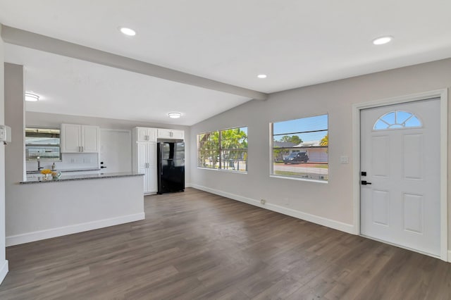 foyer with dark wood-style flooring, baseboards, and recessed lighting