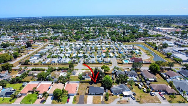 aerial view of property's location with nearby suburban area