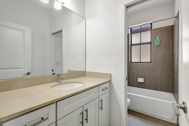 4006 Sequoia Pl W, Riviera Beach, FL 33410 - bathroom featuring toilet, vanity, and shower / bath combination