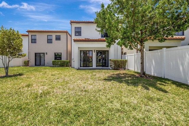 4006 Sequoia Pl W, Riviera Beach, FL 33410 - back of house with stucco siding and a tile roof
