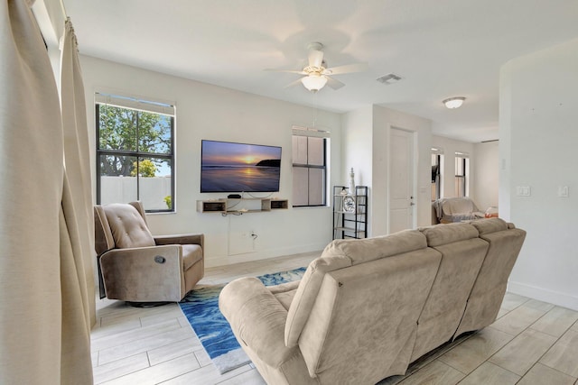 4006 Sequoia Pl W, Riviera Beach, FL 33410 - living room featuring a ceiling fan and baseboards