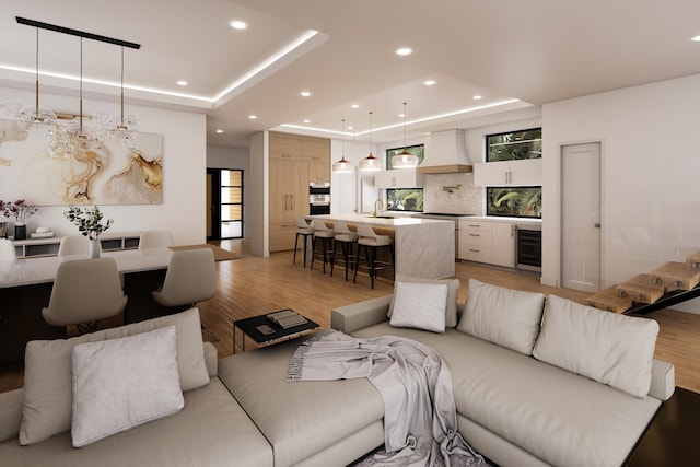 301 NE 7th Ave, Delray Beach, FL 33483 - living room with a tray ceiling, beverage cooler, light wood-style flooring, recessed lighting, and bar area