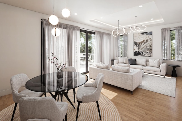 301 NE 7th Ave, Delray Beach, FL 33483 - dining room featuring healthy amount of natural light, a raised ceiling, light wood-style flooring, and recessed lighting