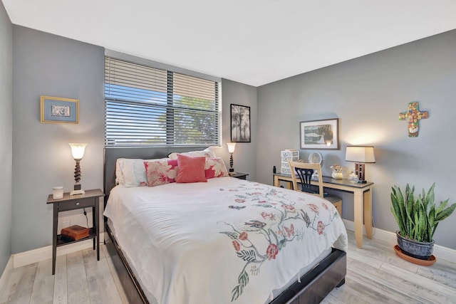 113 Lake Emerald Dr Unit 409, Oakland Park, FL 33309 - bedroom with baseboards and light wood-style floors