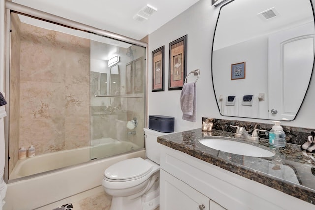 113 Lake Emerald Dr Unit 409, Oakland Park, FL 33309 - bathroom featuring toilet, combined bath / shower with glass door, vanity, and tile patterned floors