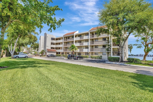 113 Lake Emerald Dr Unit 409, Oakland Park, FL 33309 - view of apartment building / complex with uncovered parking