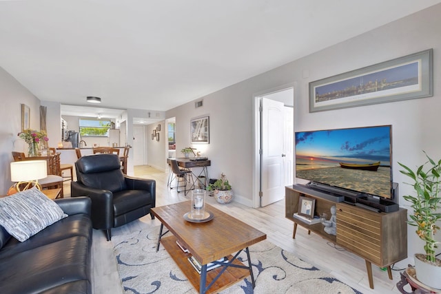 113 Lake Emerald Dr Unit 409, Oakland Park, FL 33309 - living area featuring light wood-style floors and baseboards