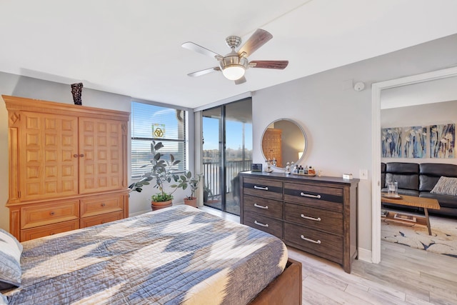 113 Lake Emerald Dr Unit 409, Oakland Park, FL 33309 - bedroom featuring light wood finished floors, access to exterior, ceiling fan, and baseboards