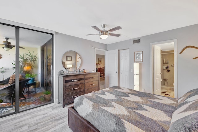113 Lake Emerald Dr Unit 409, Oakland Park, FL 33309 - bedroom with light wood-type flooring, ceiling fan, and ensuite bath