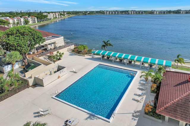 113 Lake Emerald Dr Unit 409, Oakland Park, FL 33309 - community pool with a water view, a patio, and fence