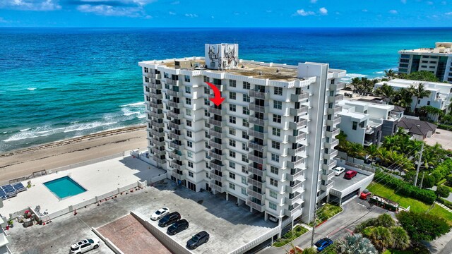 bird's eye view of expansive coastline and apartment complex