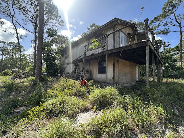 view of side of property with a wooden deck