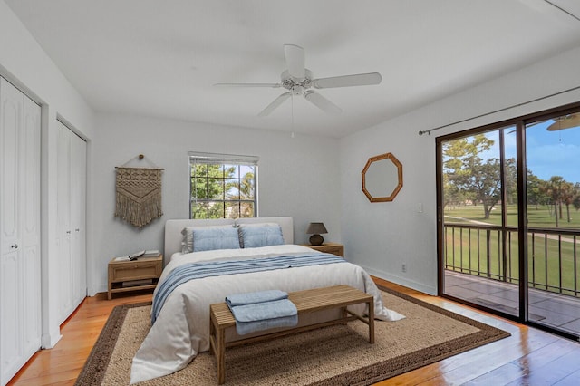 9109 SE Riverfront Ter Unit B, Jupiter, FL 33469 - bedroom featuring access to exterior, light wood-style flooring, a ceiling fan, two closets, and baseboards