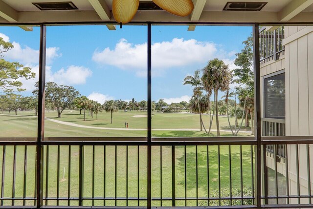 9109 SE Riverfront Ter Unit B, Jupiter, FL 33469 - unfurnished sunroom with view of golf course