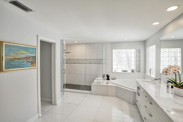 19262 Redberry Ct, Boca Raton, FL 33498 - full bathroom with a garden tub, healthy amount of natural light, a shower stall, double vanity, and recessed lighting