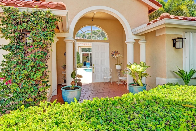 19262 Redberry Ct, Boca Raton, FL 33498 - doorway to property with stucco siding and a tile roof