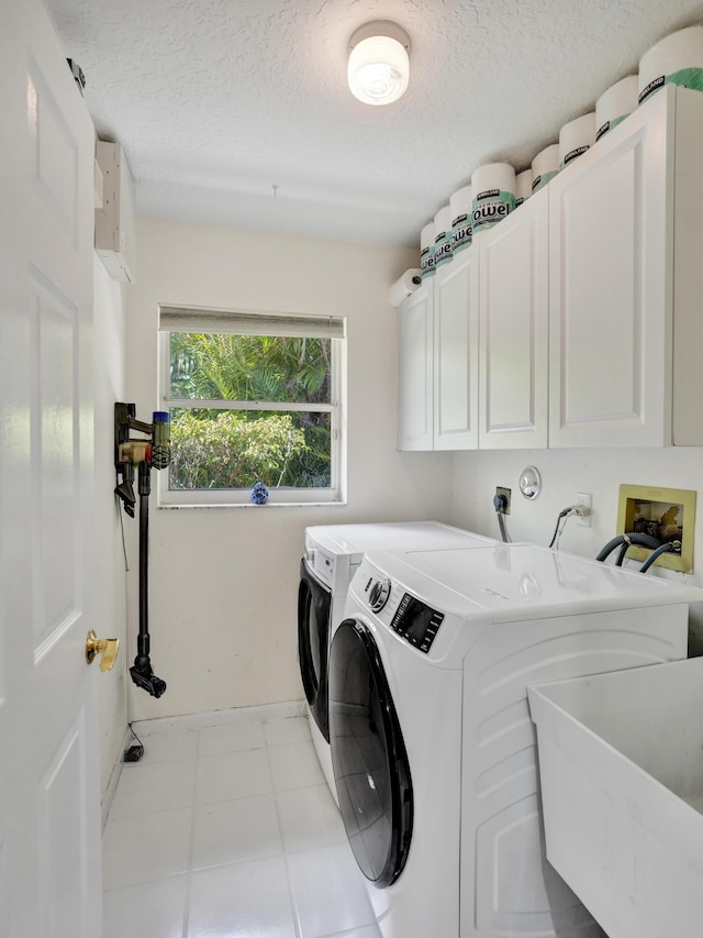 19262 Redberry Ct, Boca Raton, FL 33498 - laundry room featuring cabinet space, washing machine and clothes dryer, baseboards, and a textured ceiling