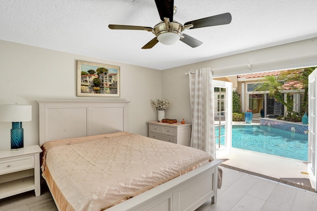 19262 Redberry Ct, Boca Raton, FL 33498 - bedroom featuring access to exterior, ceiling fan, a textured ceiling, and light wood-type flooring