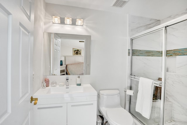 19262 Redberry Ct, Boca Raton, FL 33498 - bathroom featuring a marble finish shower, vanity, and toilet