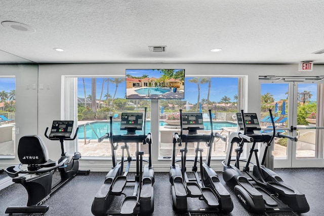 19262 Redberry Ct, Boca Raton, FL 33498 - gym featuring a textured ceiling, recessed lighting, and french doors