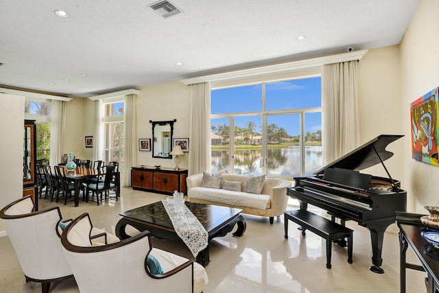 19262 Redberry Ct, Boca Raton, FL 33498 - living room featuring a water view, recessed lighting, and light tile patterned floors